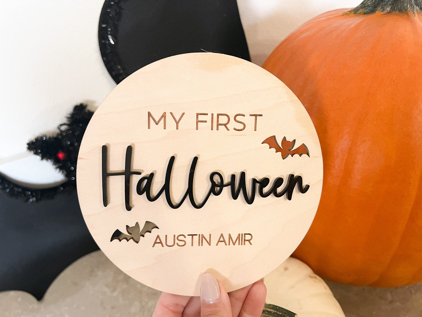 Newborn Keepsake Sign featuring the phrase "My First Halloween" with engraved bat cutouts and custom name engraving.
