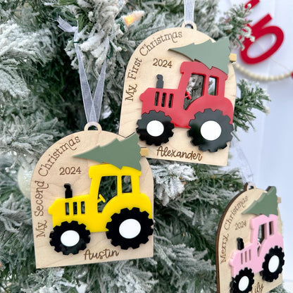 Detail shot of the Layered Acrylic Tractor in different colors, clearly showing the 3D effect of the design and the engraved saying and name.