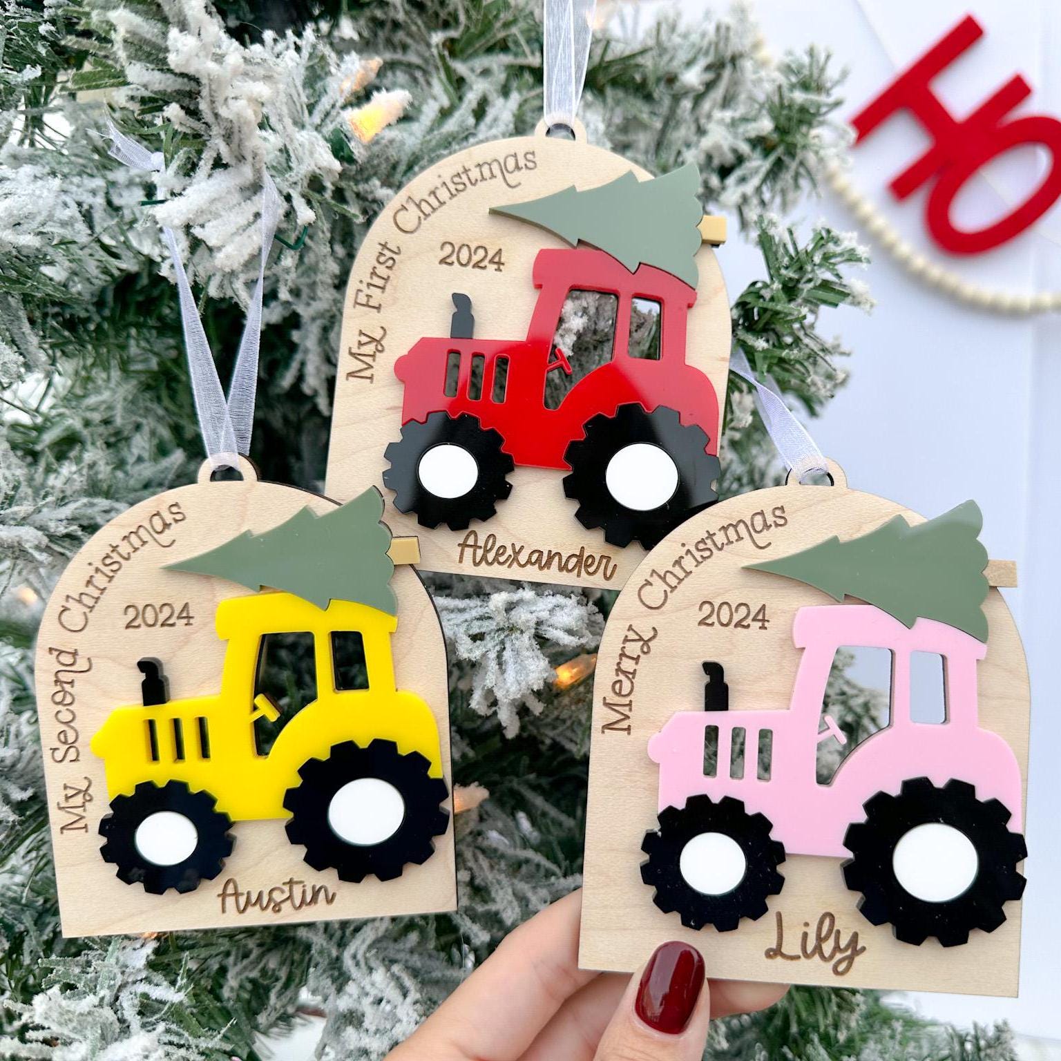 Personalized Tractor Christmas Ornament featuring various layered acrylic tractor colors and the different saying to choose from.