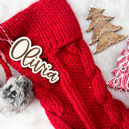 Engraved Christmas Keepsake shown with a striped tie, ready to be attached to a stocking or used as a Christmas gift identifier.