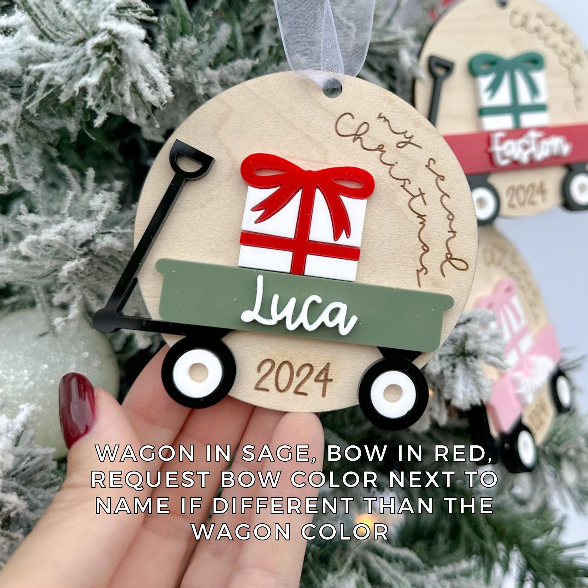 Newborn Christmas Keepsake shown hanging on a tree branch, illustrating the 3.4-inch size and its perfect fit for holiday décor.