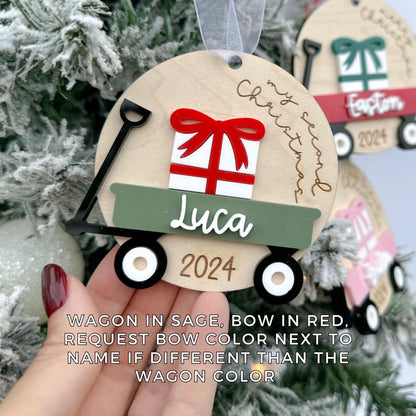 Newborn Christmas Keepsake shown hanging on a tree branch, illustrating the 3.4-inch size and its perfect fit for holiday décor.