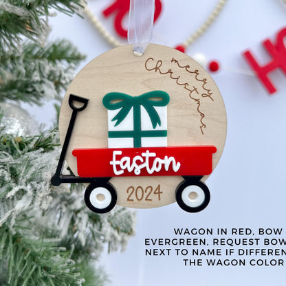Detail shot of the Wooden Wagon Ornament with the "Merry Christmas" saying, emphasizing the quality of the maple plywood and the crisp layering.