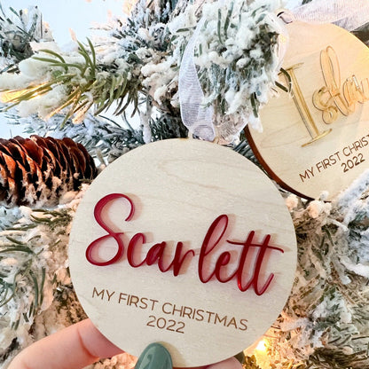Detail shot of the Custom Baby Ornament showing the thickness of the maple plywood and the white ribbon hanger.