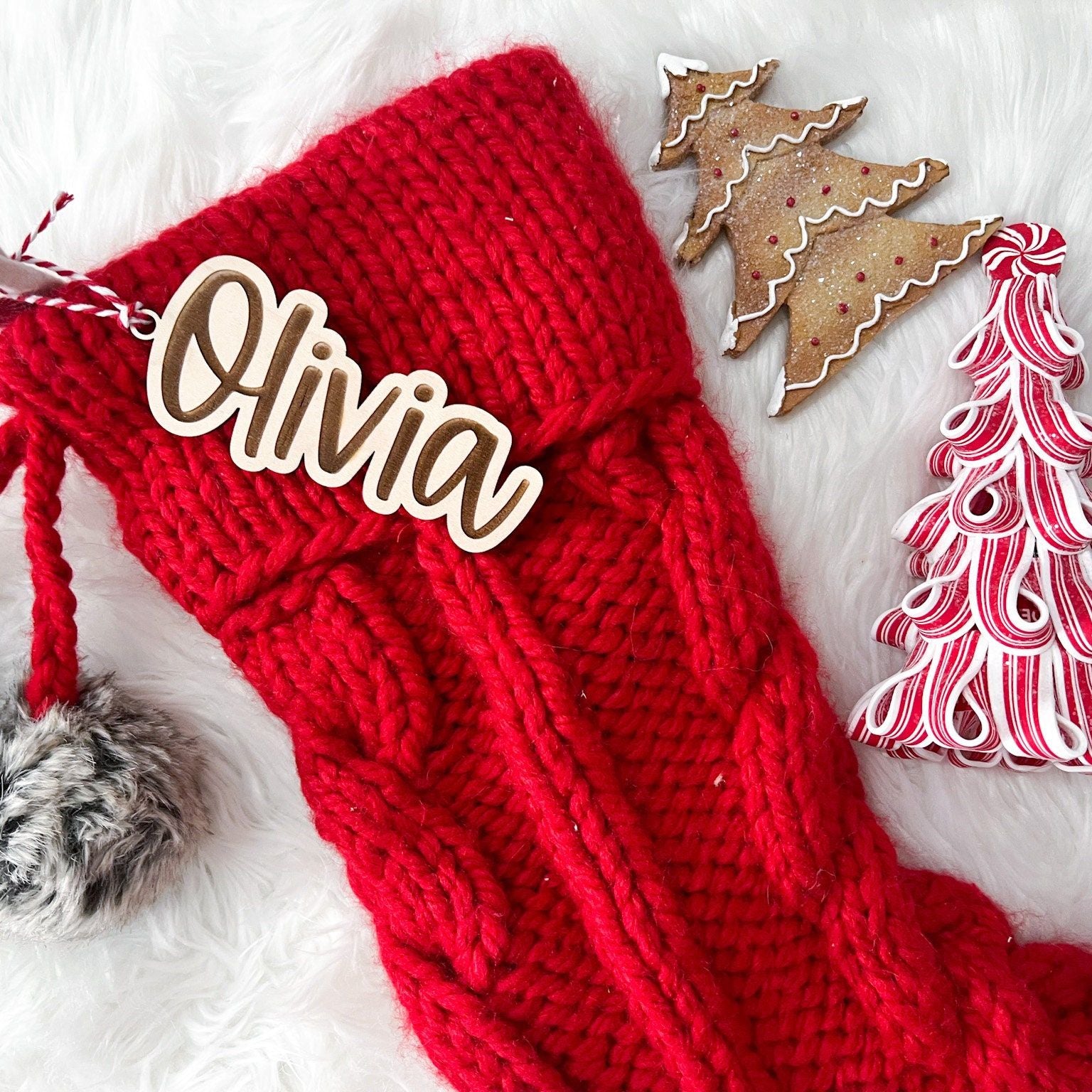 Engraved Christmas Keepsake shown with a striped tie, ready to be attached to a stocking or used as a Christmas gift identifier.