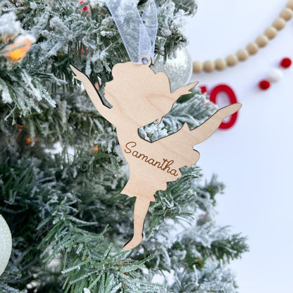 Engraved Ballerina Silhouette ornament hung on a Christmas tree, emphasizing the 4-inch size and its use as a dance recital gift.