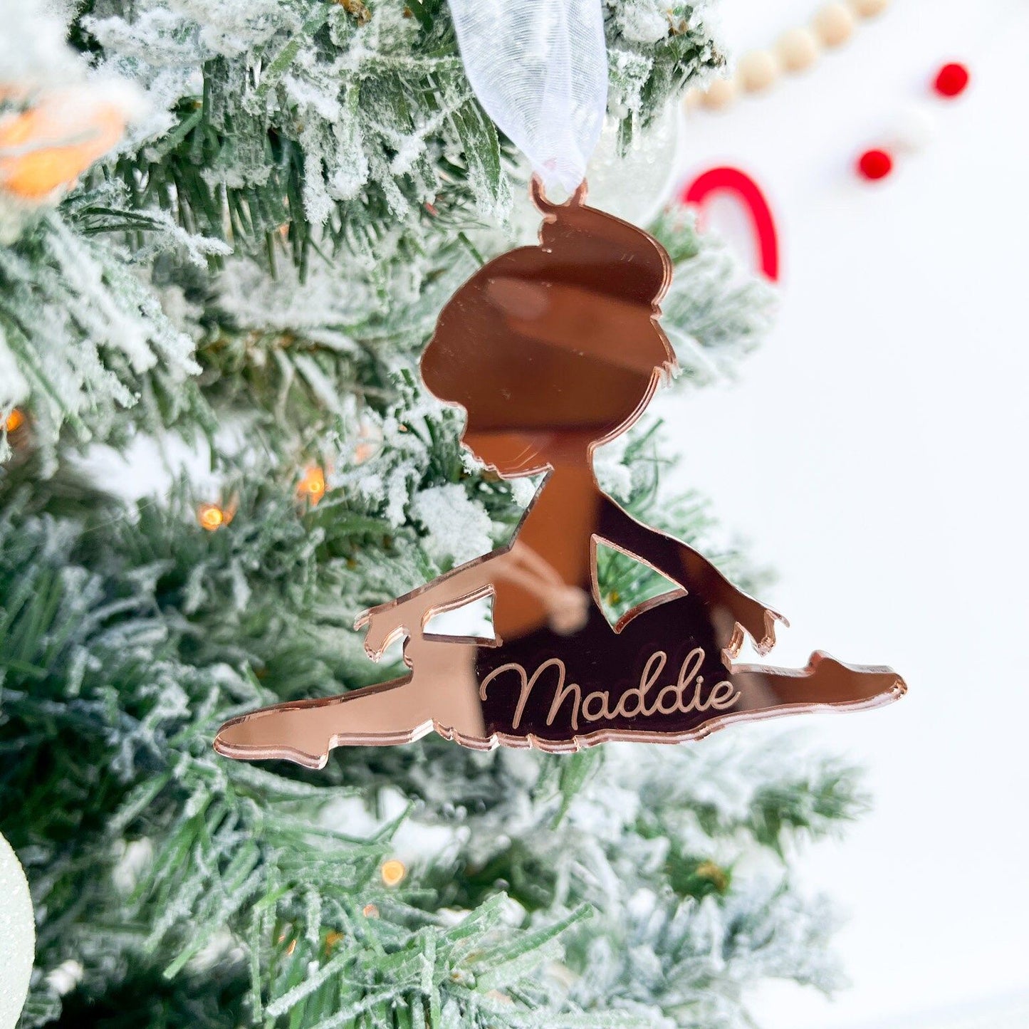 Close-up of the shatterproof Dancer Keepsake made from gold mirror acrylic, emphasizing the crisp laser-cut Split Pose silhouette.