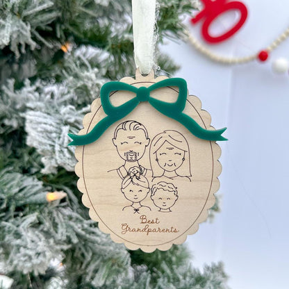 Custom Family Portrait Ornament featuring an engraved line-drawn portrait of a family of four, framed by the elegant scalloped wood edge.