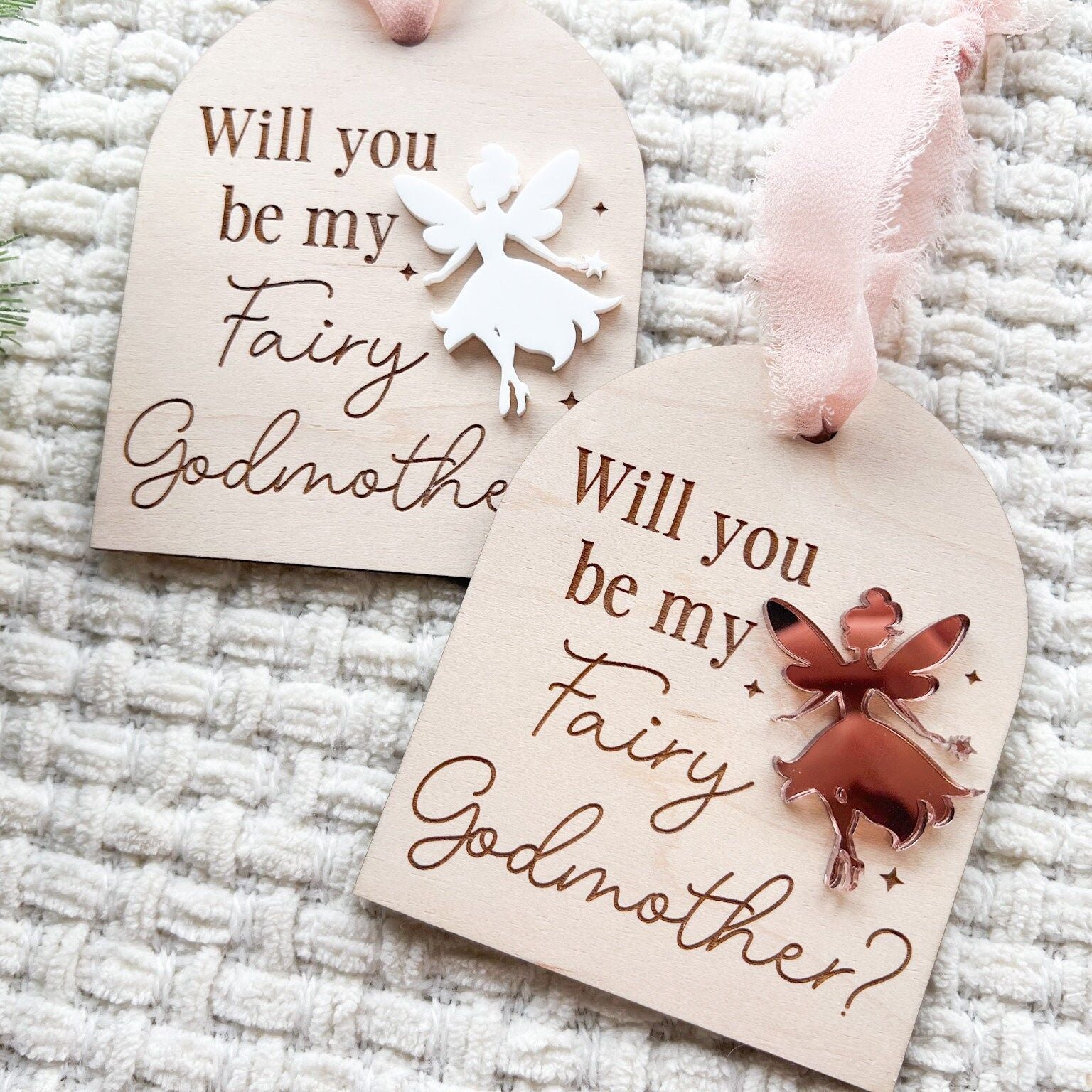 Two Fairy Godmother Proposal Ornaments side-by-side, showcasing different acrylic fairy color options (e.g., silver mirror and white).