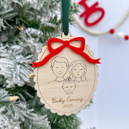 Personalized Family Keepsake hung on a Christmas tree, displaying the engraved year (2025) and custom family name text below the portrait.
