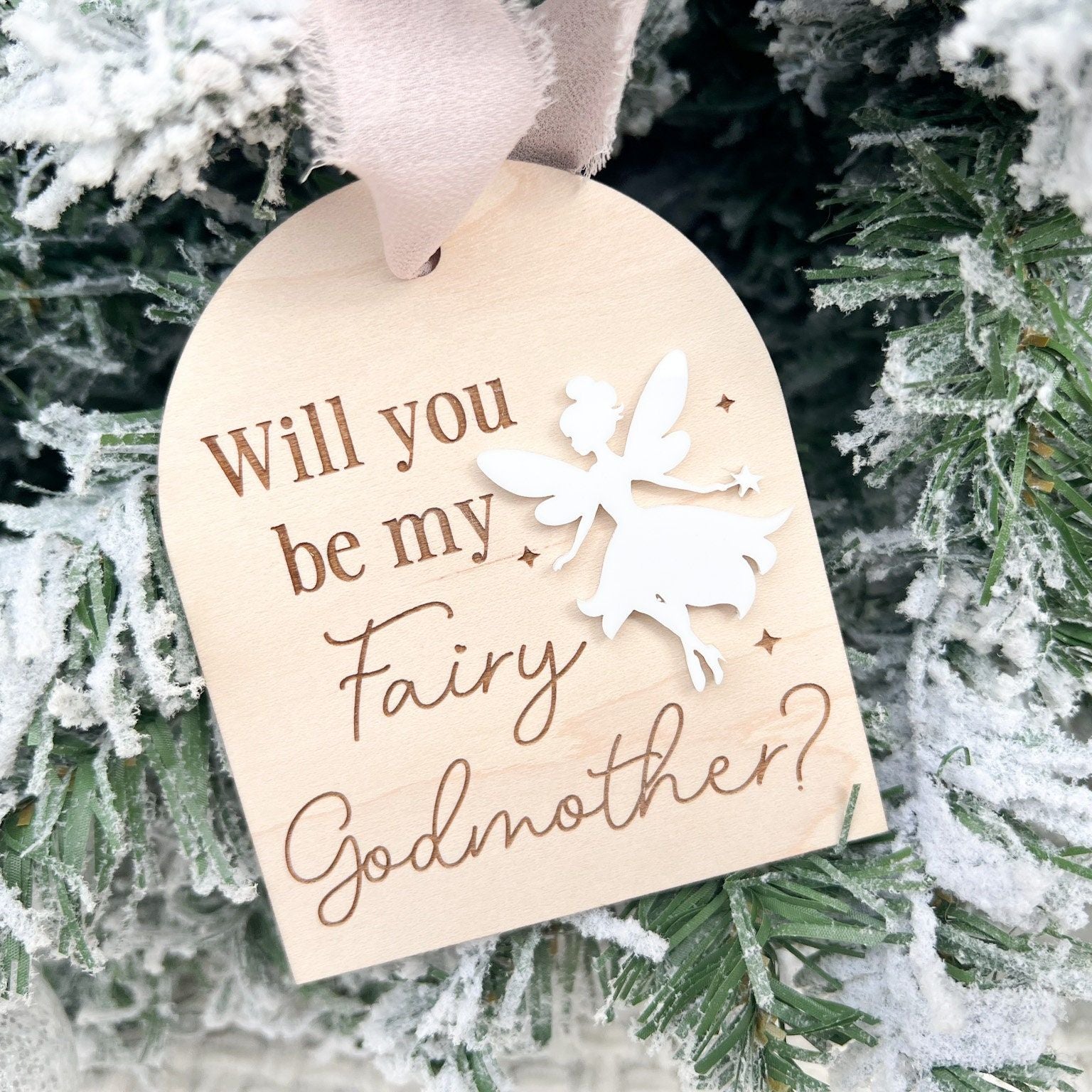 Close-up of the Wooden Godmother Keepsake detailing the laser-engraved question and star accents on the maple wood base.