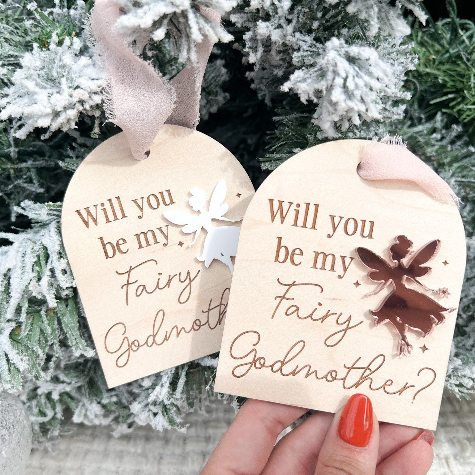 Two Fairy Godmother Proposal Ornaments side-by-side, showcasing different acrylic fairy color options (e.g., silver mirror and white).