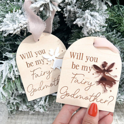 Two Fairy Godmother Proposal Ornaments side-by-side, showcasing different acrylic fairy color options (e.g., silver mirror and white).