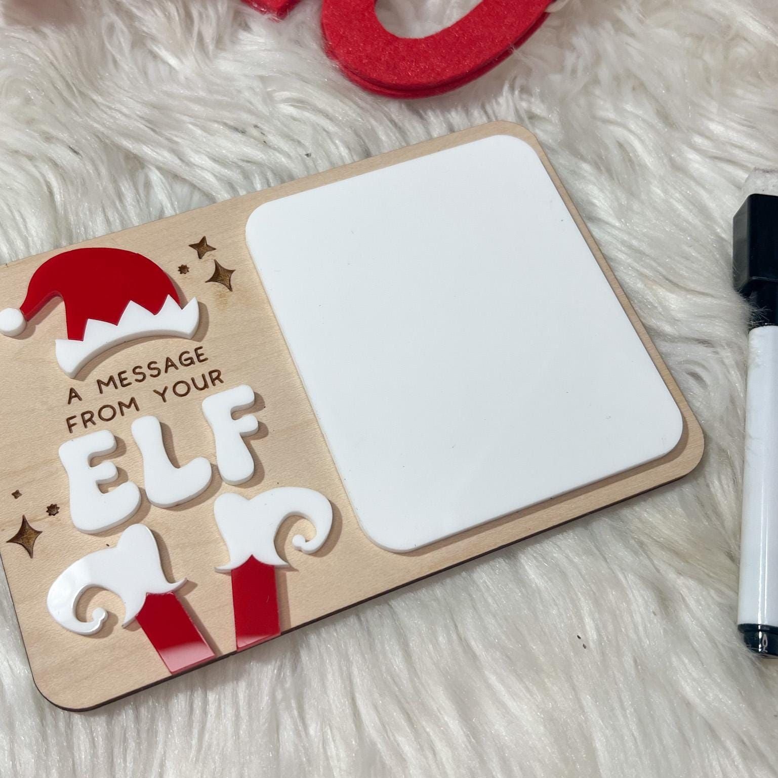 Small Reusable Elf Sign displayed on a miniature easel prop, demonstrating the perfect size for an Elf on the Shelf display.