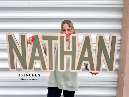 Wooden nursery sign. Baby name sign in 35" it also comes in 24", 30" and 40".  This sign is perfect to decorate baby's nursery.  The font in this kids room is in an serif font in color sage.
