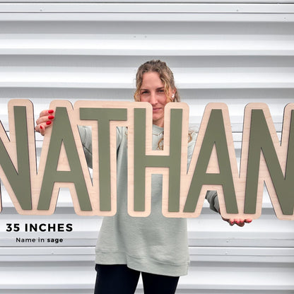Wooden nursery sign. Baby name sign in 35" it also comes in 24", 30" and 40".  This sign is perfect to decorate baby's nursery.  The font in this kids room is in an serif font in color sage.